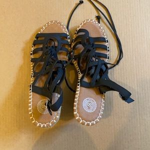 Black sandals with tie around ankle